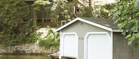 View of the house and boathouse from the lake.