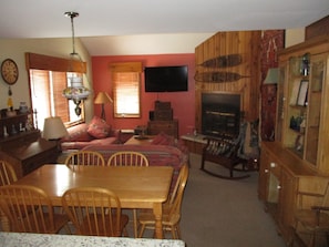Main living and dining room, with wood burning fireplace and HDTV 