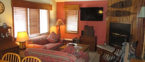 Main upper level living room. HDTV and wood burning fireplace