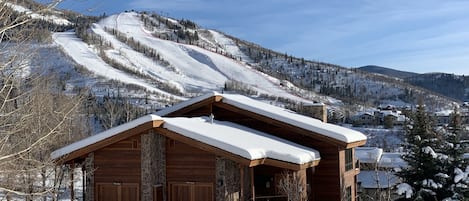 In the winter, enjoy this snow-covered beauty as your mountain home