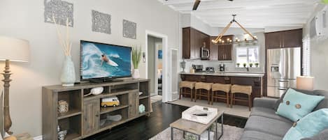 View of main living spaces from the front Dutch door entry. Open floor plan between living, kitchen and eating areas.