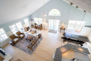 Large, open great room with kitchen, dining and living. One min walk to pool.