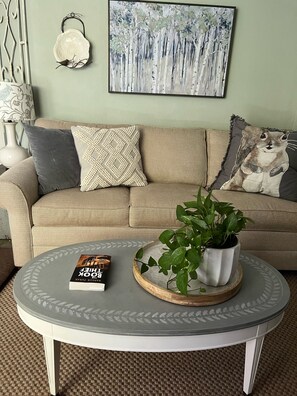 New couch and handpainted coffee table.