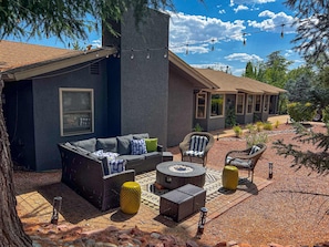 Fire pit area with ample seating for everyone in the group.