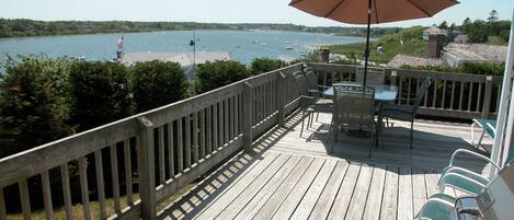 Wraparound deck has spectacular panoramic water views of the Oyster Pond. 
