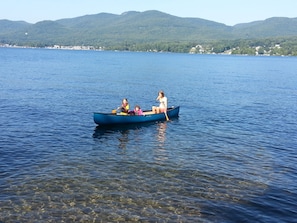 The girls canoeing in front of our house