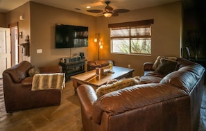 Living room with large flatscreen TV.