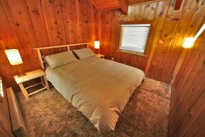 Upstairs bedroom with queen-size bed.