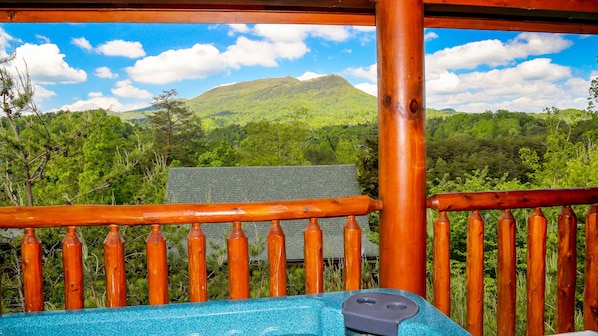 Relax and enjoy the spectacular view of Bluff Mountain from the hot tub!