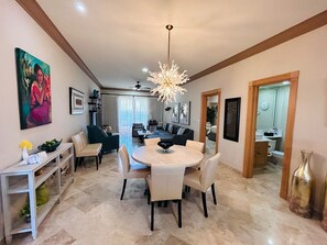 Dining area with unique lighting fixture