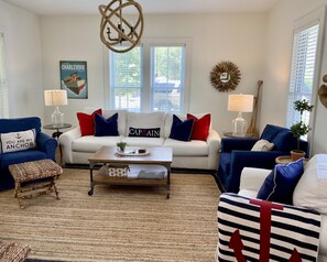 Large living room with enough quality comfortable seating for everyone.