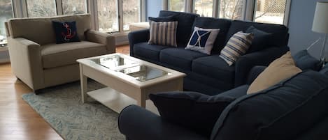 Living Room with all windows on 2 sides for water view of the lake