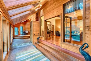 Sun room entry is a  perfect place to read or dry ski & snowboard equipment