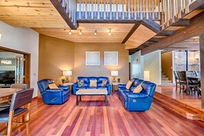 Everyone stays connected in the open concept main level off of the sunroom entry