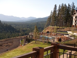 View of the pool from living room balcony