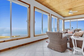 Unobstructed views of Lake Michigan waters from the four seasons room