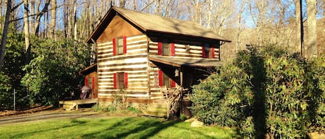 Exterior of cabin as the  sun sets.