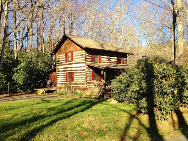 Exterior of cabin as the  sun sets.