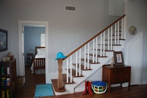 Stairs to crow's nest and doorway to master bedroom