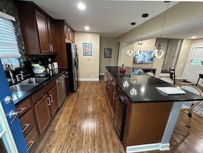 Oven, fridge, microwave, dishwasher, cook top,  65" TV.