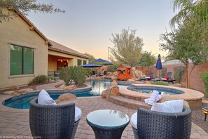 Resort style pool with multiple spots to relax and enjoy outdoor living