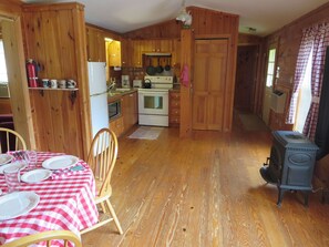 Kitchen and dining area with gas fired propane stove. 