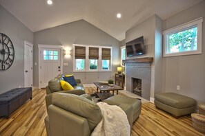 Living area, windows make it bright and cheery.