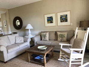 Living Area overlooking pool waterfall and beach walkway 