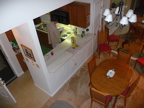looking down on the dining area from the loft bedroom