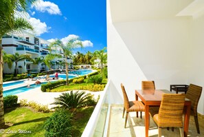 Amazing View of Pool! Relax in the Breeze on the Front Terrace off Living room.