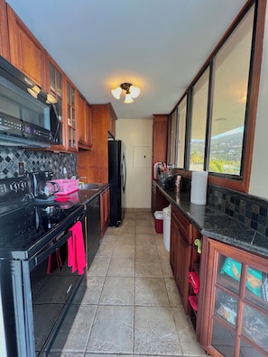 Fully stocked kitchen with new appliances 