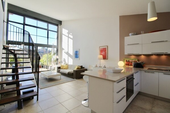 When entering the house, you find the kitchen and living area bathed in light