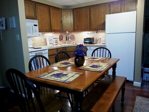 Fully equipped kitchen with seating for six.