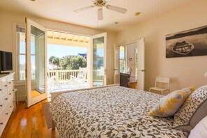 Wake up to the ocean! This master bedroom is located on the first floor with its own porch access.