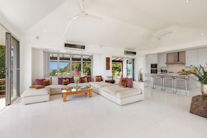 Spacious, modern lounge with ocean views & open kitchen.