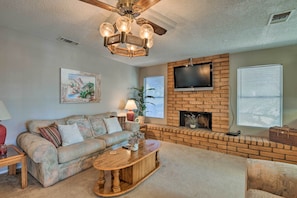 Den | Flat-Screen TV | Decorative Fireplace