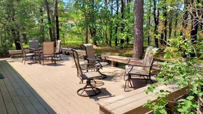 Front deck with lounge furniture and table and chairs