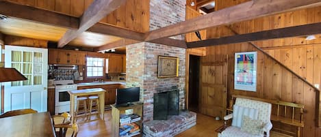 Main living area with knotty pine and exposed beams