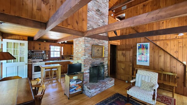 Main living area with knotty pine and exposed beams