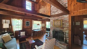 Main living area with knotty pine and exposed beams