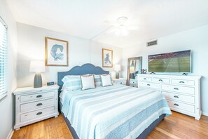 A serene bedroom with a soft blue color palette, offering a peaceful retreat.