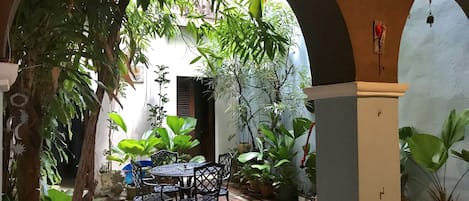 Kitchen opens up to the open Spanish Colonial Patio