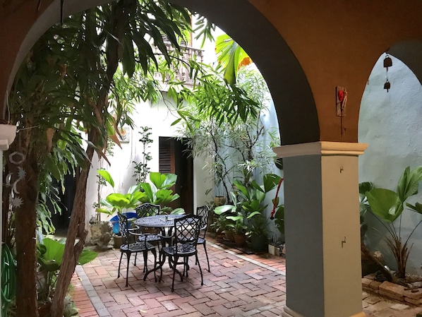 Kitchen opens up to the open Spanish Colonial Patio