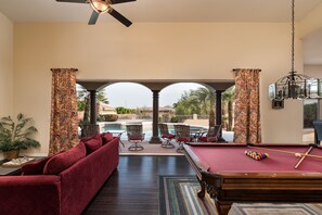 Entertainment Area viewing Pool and Outdoor dining area