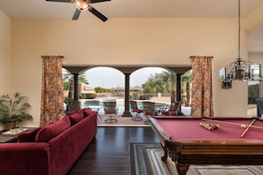 Entertainment Area viewing Pool and Outdoor dining area