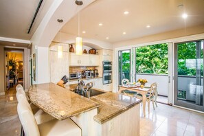 Fully Equipped Gourmet Kitchen with Garden View