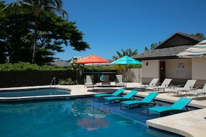 Relax the day away in the pool lounge chairs