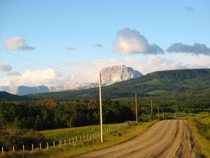 The 2 mile road to Payne Lake Lodge. Old Chief Mountain welcomes you home.