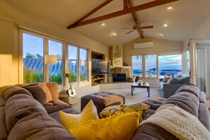 Family room with large TV, sweeping ocean view and seating for 12 +