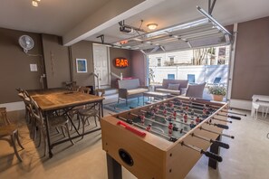 Entertainment area with garage door for open access to back patio
